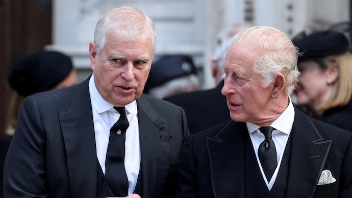 Britain's Prince Andrew speaks with King Charles